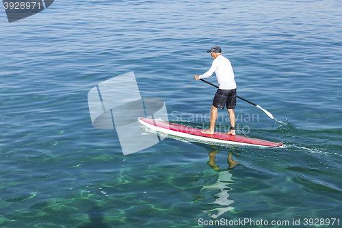 Image of Senior man practicing paddle