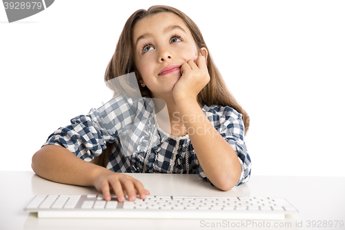 Image of Little girl working with a computer