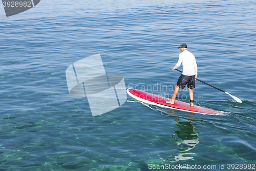 Image of Senior man practicing paddle