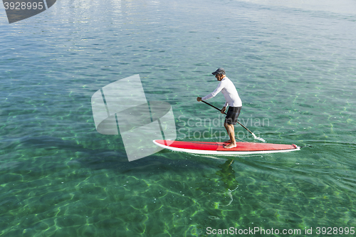 Image of Senior man practicing paddle