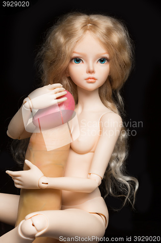 Image of concept. Doll with different sex toys.