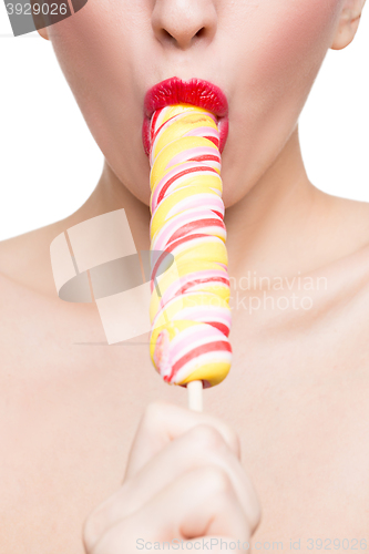 Image of Close-up shot of woman\'s mouth bright red lips with lollipop. blowjob simulation