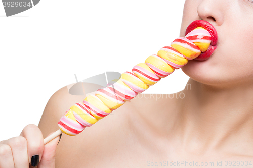 Image of Close-up shot of woman\'s mouth bright red lips with lollipop. blowjob simulation