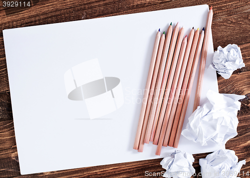 Image of paper on wooden background