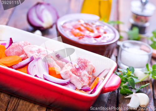 Image of raw meat with vegetables