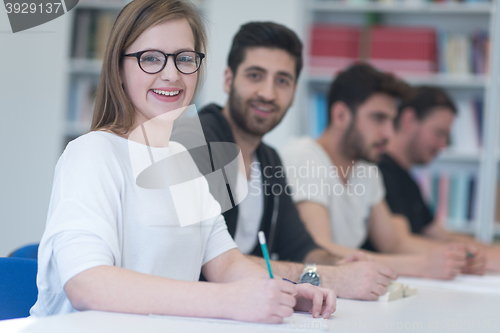 Image of group of students study together in classroom