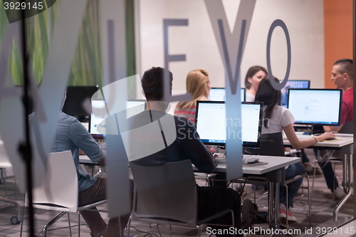 Image of technology students group working  in computer lab school  class