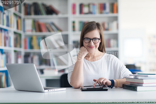 Image of female student study in school library