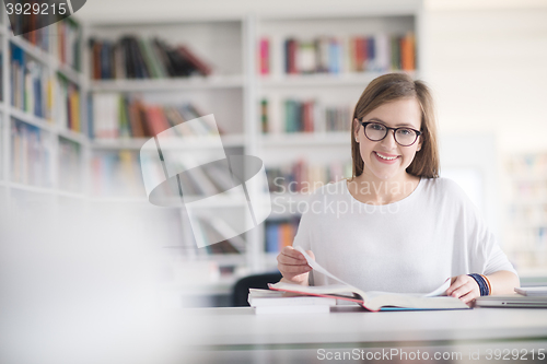 Image of female student study in school library