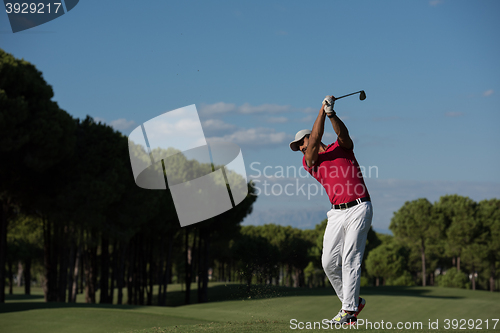 Image of golf player hitting long shot