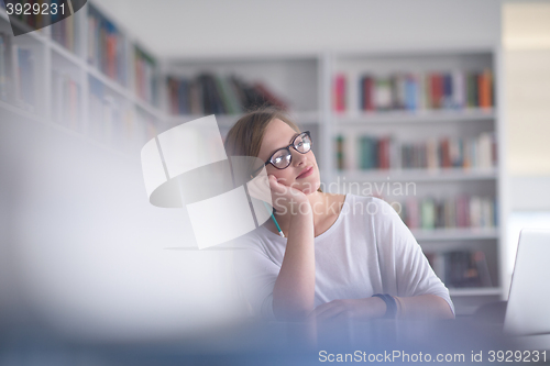 Image of female student study in school library