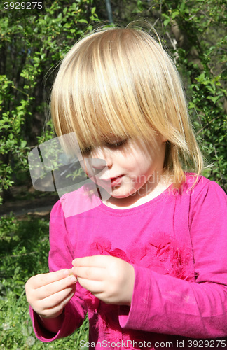 Image of Young girl playing in the park