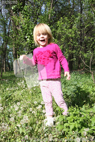 Image of Young girl playing in the park