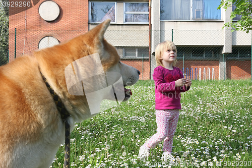 Image of Young girl and dog