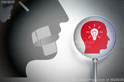 Image of Data concept:  Head With Light Bulb with optical glass on digital background
