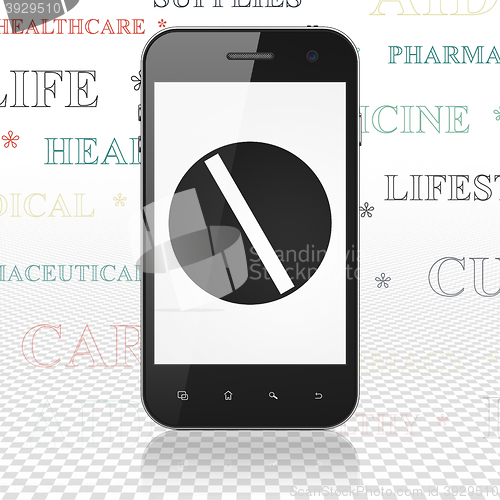 Image of Health concept: Smartphone with Pill on display