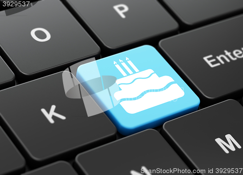 Image of Entertainment, concept: Cake on computer keyboard background