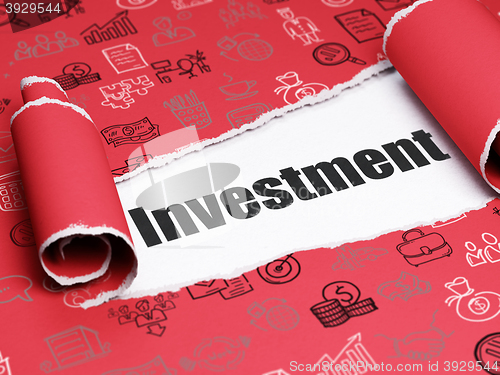 Image of Business concept: black text Investment under the piece of  torn paper