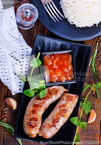 Image of boiled rice with sausages