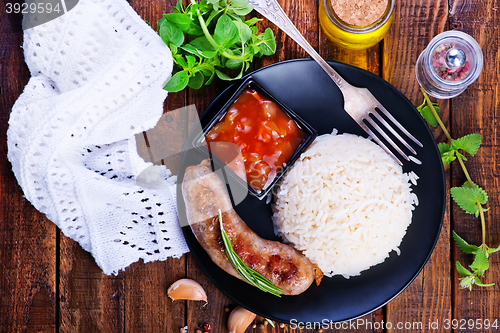 Image of boiled rice with sausages