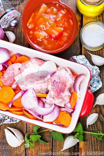 Image of raw meat with vegetables