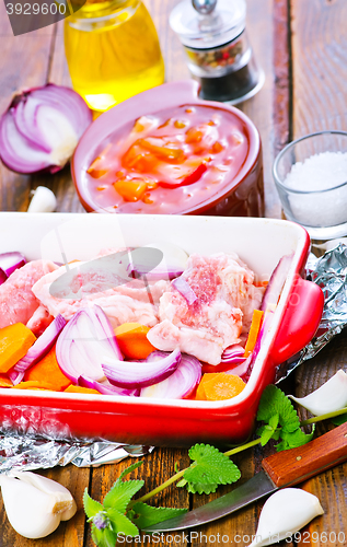 Image of raw meat with vegetables