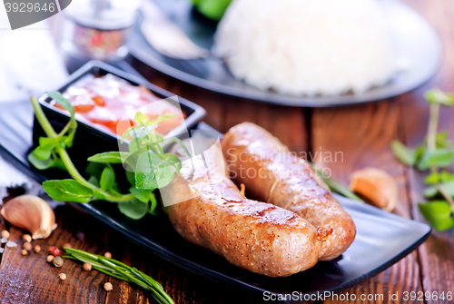 Image of boiled rice with sausages