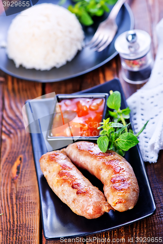 Image of boiled rice with sausages