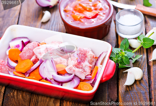 Image of raw meat with vegetables