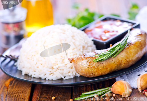 Image of boiled rice with sausages