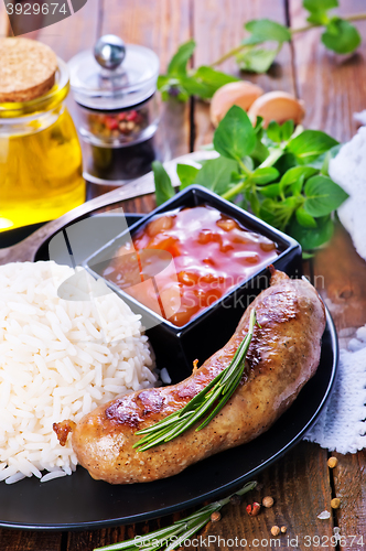 Image of boiled rice with sausages