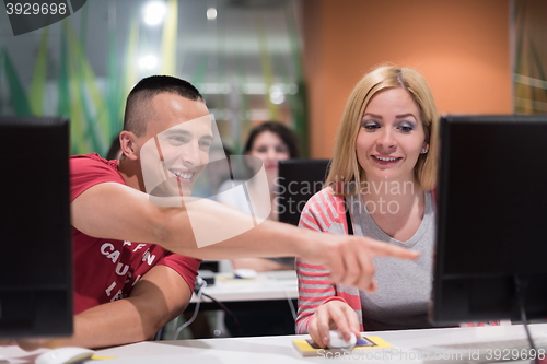 Image of technology students group working  in computer lab school  class