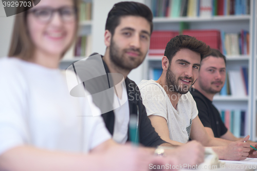 Image of group of students study together in classroom