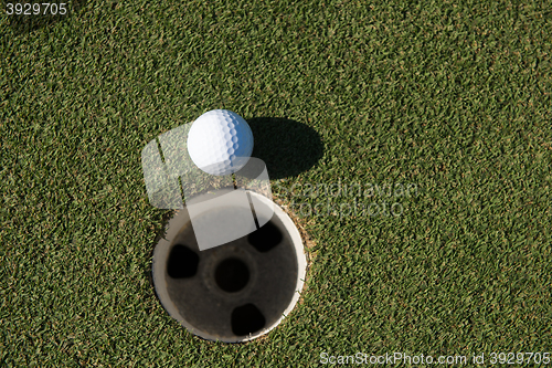 Image of top view of golf ball in the hole