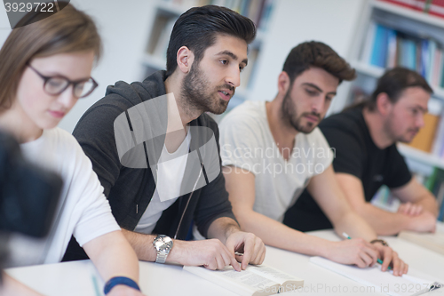 Image of group of students study together in classroom