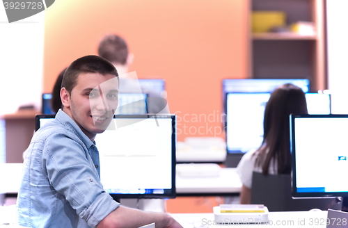 Image of technology students group in computer lab school  classroom