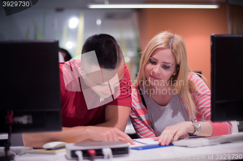 Image of technology students group working  in computer lab school  class