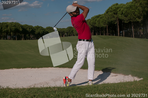 Image of golfer hitting a sand bunker shot