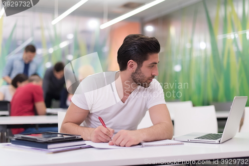 Image of male student in classroom