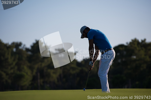 Image of golfer hitting long shot