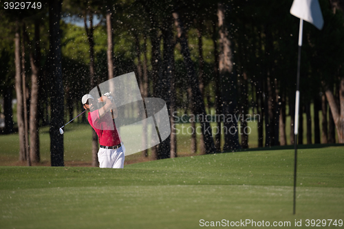 Image of golfer hitting a sand bunker shot