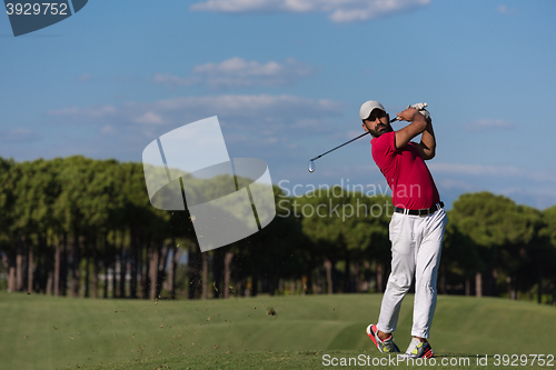 Image of golf player hitting long shot