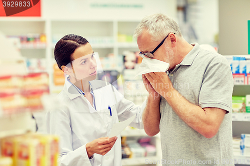 Image of pharmacist and senior man with flu at pharmacy