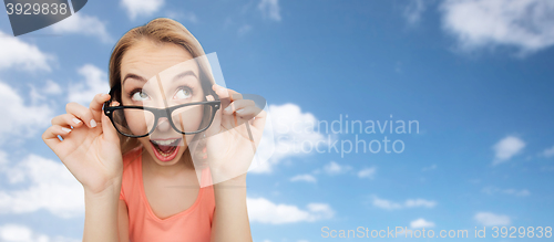 Image of happy young woman or teenage girl in eyeglasses