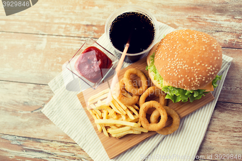 Image of close up of fast food snacks and drink on table