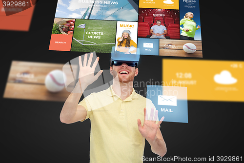 Image of happy man in virtual reality headset or 3d glasses