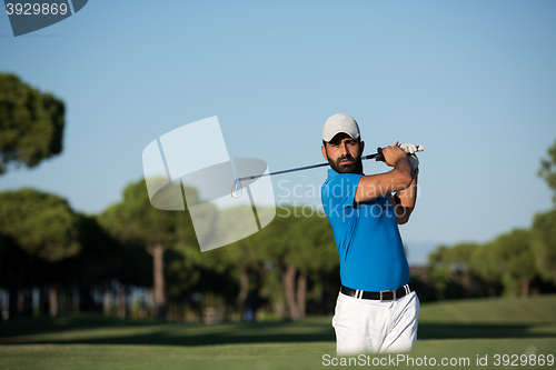 Image of pro golfer hitting a sand bunker shot