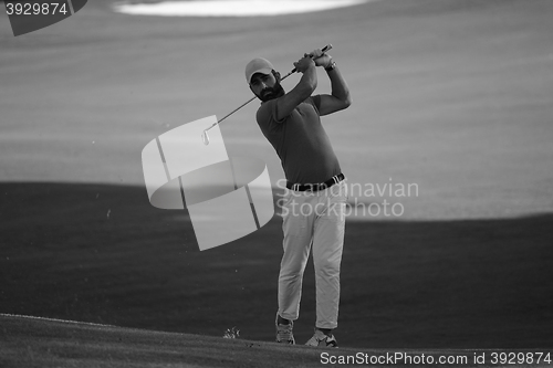 Image of golf player hitting long shot