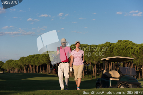 Image of portrait of golfers couple on golf course