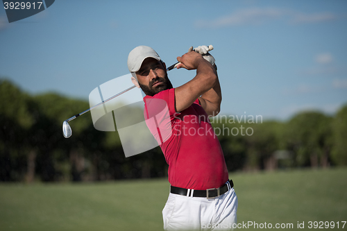 Image of golfer hitting a sand bunker shot